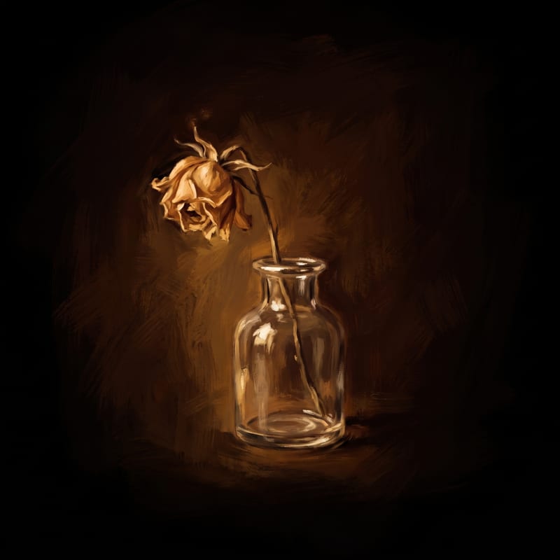 A single wilted flower in a small glass